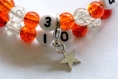 Bracelet d'allaitement sur fil à mémoire de forme de 55mm avec perles en verre craquelée de couleur orange et transparent 