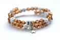 Bracelet d'allaitement sur fil à mémoire de forme de 55mm avec perles en acrylique de couleur marron 