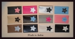 Porte chéquier simili cuir avec une décoration étoile de différentes couleurs 