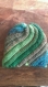 Joli bonnet en spirale bleu vert 