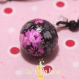 Bola de grossesse bulan bola xylophone motif rose sur fond noir 
