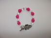 Bracelet en perles de verre rose vifs et de cristal transparent 