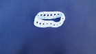 Bracelet réalisé au crochet de couleur blanche 