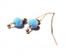 Chaînes d'oreilles en acier inoxydable , pompons bleus et perles en métal argenté 