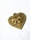 Breloque pendentif coeur bronze avec petit noeud 20 mm 