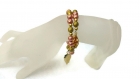 Bracelet en perles rondes roses et dorées. 