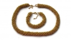 Parure collier et bracelet en perles synthétiques dorées : collection les soirees 