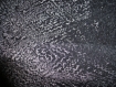 N°64-tissu en velours leger noir extensible brillant a motifs en relief