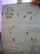 Grand collier perles en os, anneaux et pierres 