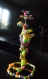 Fleur en perles plastique et fantaisie multicolores fait main avec du fil 