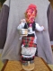 Une petite poupée bulgare traditionnelle- "la porteuse d'eau" en cuillère de bois 