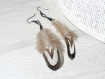 Boucles d'oreilles country plumes ethniques noir et blanc 