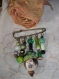 Broche/épingle : tons verts - perle centrale argile modelée et peinte 