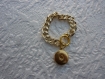 Bracelet chaine de couleur doré avec une plate forme 