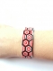 Très joli bracelet noir blanc et rouge tissé en perles miyuki montée sur bracelet rigide 