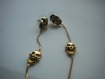 Boucles d'oreilles trio de têtes de mort en métal doré