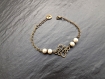 Bracelet " sonali " composé de perles en verre nacré ivoire 