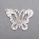 Breloque papillon métal blanc et argenté 37 mm 