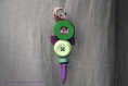 Broche multi boutons violets et verts