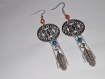 Bijou de créateur boucle d'oreille coloris argenté, "dreamcatchers" plume, perle cristal bleu et orange 