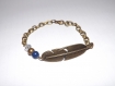 Jolie bracelet plume ethnique , bronze avec perle bleu lapis lazuli cristal transparent 