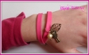 Bracelet double en tissu rose avec breloques couleur bronze 
