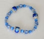 Bracelet en perles de porcelaine, cristal et "oeil de chat" bleues 