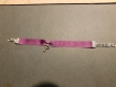 Bracelet violet avec ça clé 