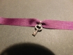 Bracelet violet avec ça clé 