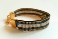 Bracelet en perles miyuki tressées motif central triangle, couleurs noir doré et blanc 