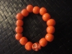 Bracelet perles et tète de mort orange