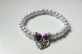Bracelet en perles avec pendentif sur fil élastique 