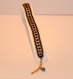 Bracelet manchette herringbone perles de rocaille miyuki 11/0 noires et plaqueés or avec toupies swarovski jet hematite fermoir 